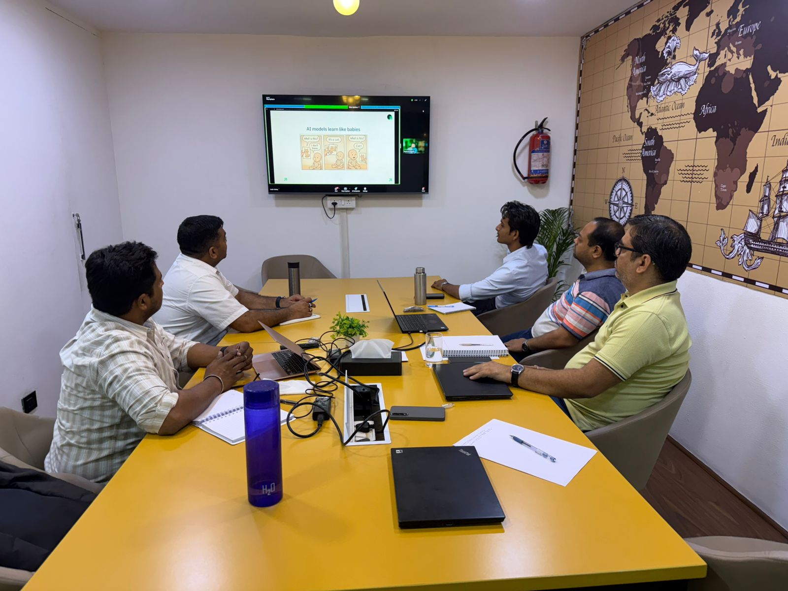 Team meeting with AI session on screen